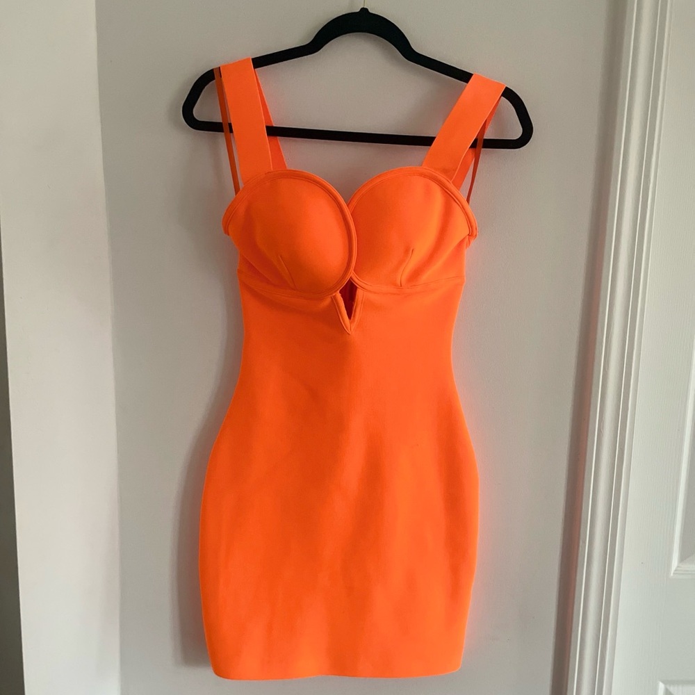 Deep plunge bodycon mini dress in Neon Orange. 
Size L